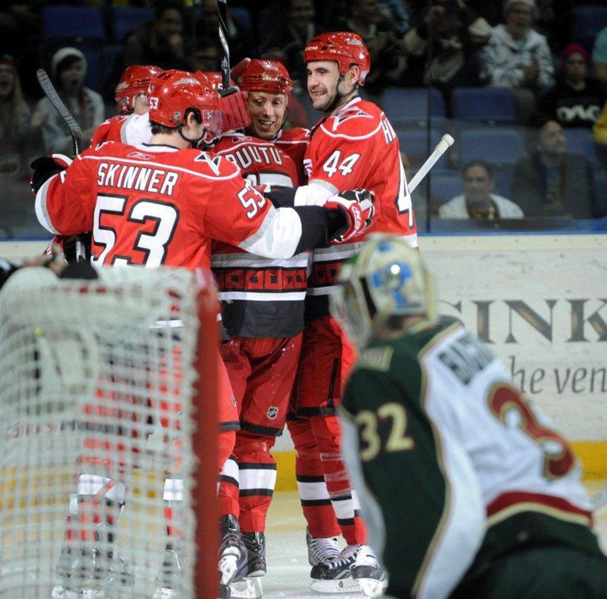 Hurricanes' Jeff Skinner (L), Jay Harrison (R) and Jussi Jokinen (L) celebrate Tuomo Ruutu's (C) game-tying 1-1 goal during the ice hockey NHL regular season game Carolina Hurricanes vs Minnesota Wild in Helsinki on October 8, 2010. AFP PHOTO LEHTIKUVA / Heikki Saukkomaa *** FINLAND OUT *** LEHTIKUVA / AFP FINLAND OUT.