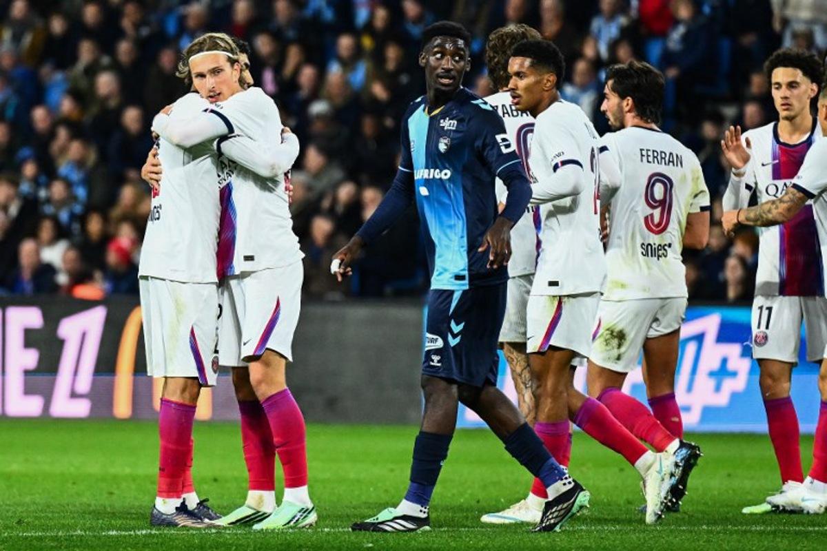 PSG's Belgian forward #22 Mika Godts (2L) celebrates scoring his team's first goal during the French L1 football match between Le Havre Athletic Club and Paris Saint-Germain (PSG) at Stade Oceane in Le Havre, north-western France on October 30, 2026. Guillaume SALIGOT / AFP