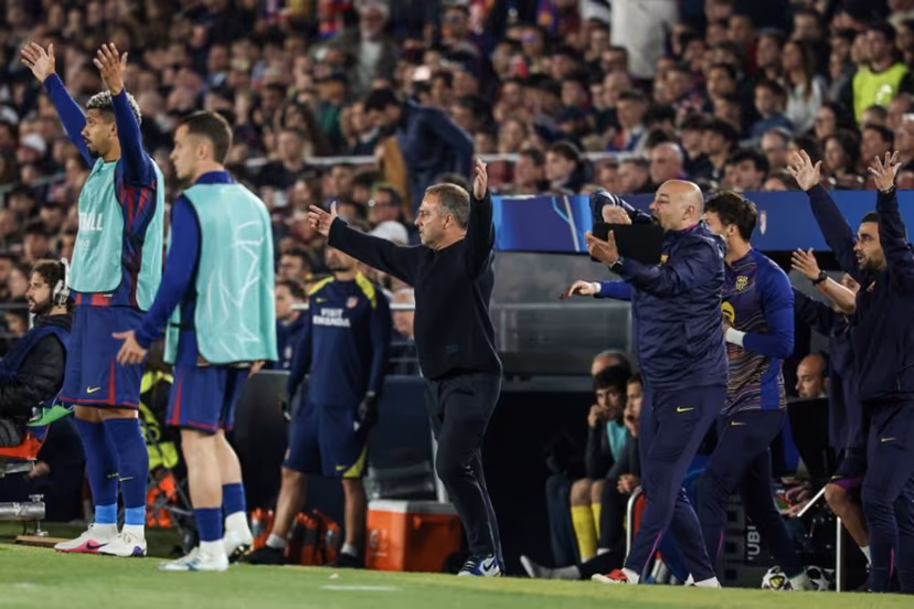 Barcelona's German coach Hans-Dieter Flick (C) gestures during the UEFA Champions League quarter final first leg football match between FC Barcelona and Club Atletico de Madrid at Camp Nou Stadium in Barcelona on April 8, 2026. Lluis GENE / AFP