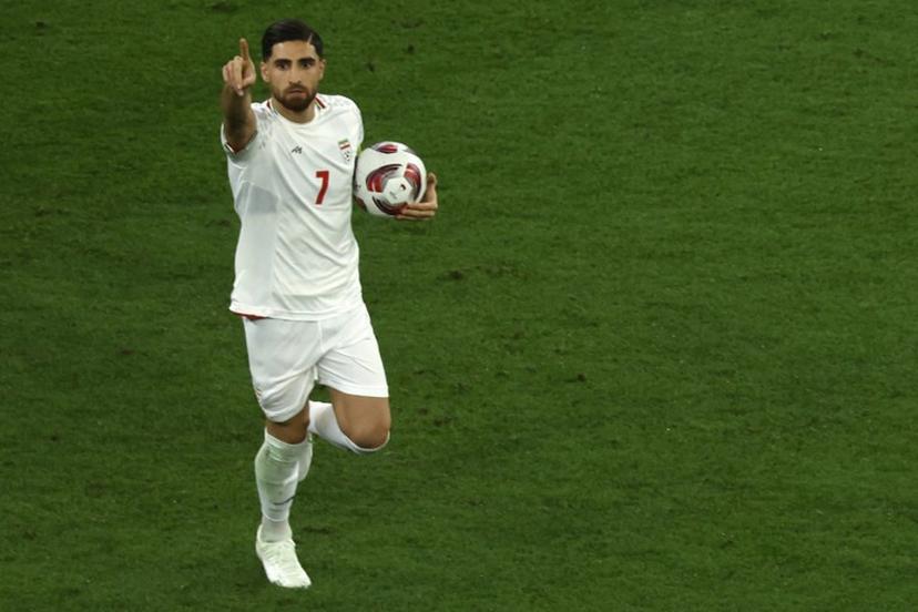 Iran's midfielder #07 Alireza Jahanbakhsh celebrates after scoring his team's second goal from the penalty spot during the Qatar 2023 AFC Asian Cup semi-final football match between Iran and Qatar at al-Thumama Stadium in Doha on February 7, 2024.  KARIM JAAFAR / AFP