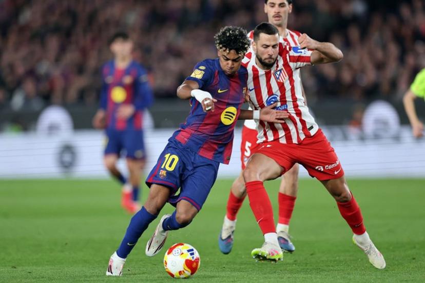 Barcelona's Spanish forward #10 Lamine Yamal and Atletico Madrid's Slovak defender #17 David Hancko fight for the ball during the Copa del Rey (King's Cup) semi final second leg football match between FC Barcelona and Club Atletico de Madrid at Camp Nou Stadium in Barcelona on March 3, 2026. Josep LAGO / AFP