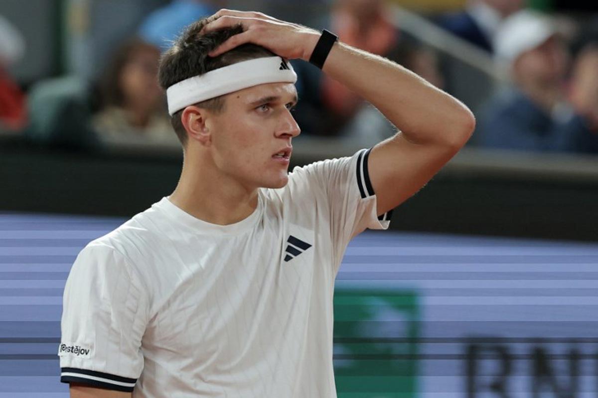 Czech Republic's Jakub Mensik reacts as he plays against Brazil's Joao Fonseca during their men's quarter final singles match on day 10 of the French Open tennis tournament on Court Philippe-Chatrier at the Roland-Garros Complex in Paris on June 2, 2026. Thomas SAMSON / AFP