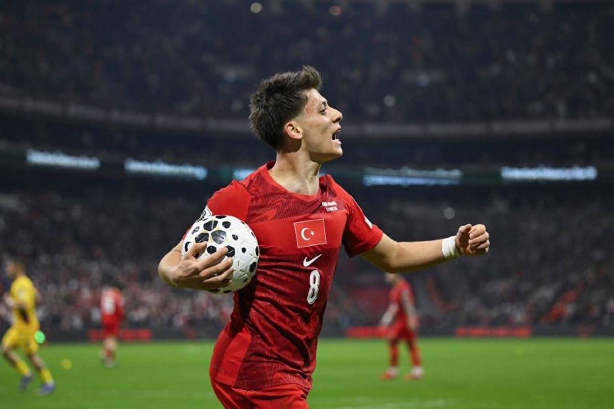 Turkey's midfielder #08 Arda Guler reacts during the play-off FIFA World Cup 2026 European qualification knockout semi-final football match between Turkey and Romania at Besiktas Park stadium, in Istanbul on March 26, 2026. YASIN AKGUL / AFP