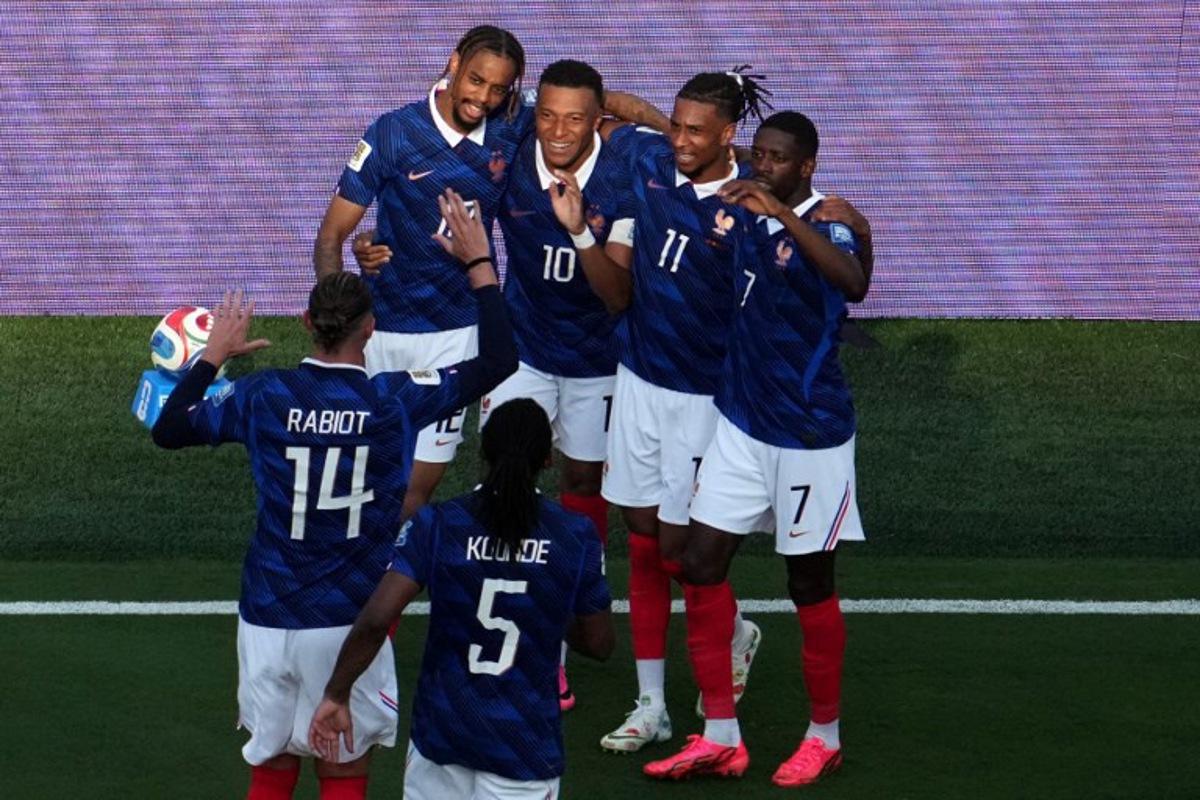 France's forward #10 Kylian Mbappe celebrates scoring his team's third goal with teammates during the 2026 World Cup round of 32 football match between France and Sweden at the New York/New Jersey Stadium in East Rutherford on June 30, 2026. TIMOTHY A. CLARY / AFP