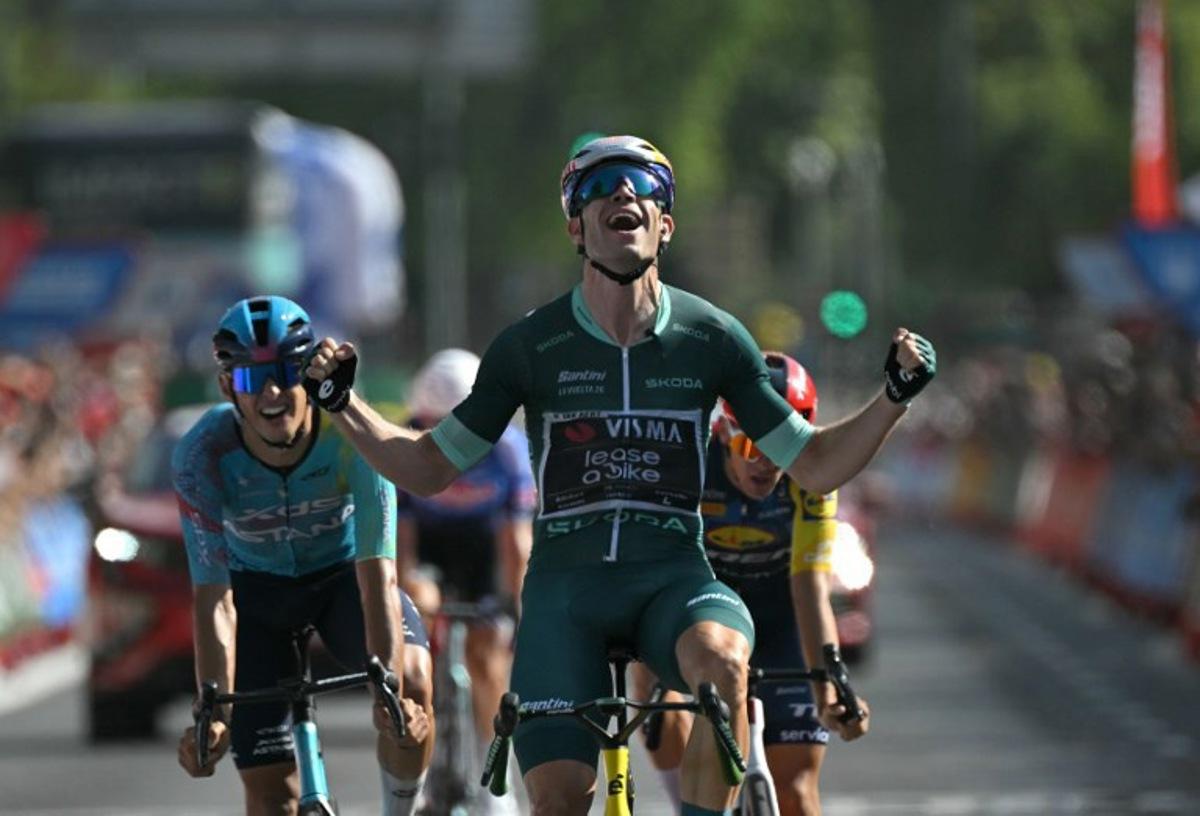 Team Visma-Lease a bike's Belgian rider Wout van Aert celebrates winning the 15th stage of the Vuelta a Espana 2026 cycling tour, a 110,2 km race which was modified from the original itinerary of 189,7 km following the activation of the high temperature protocal, between Palma del Rio and Cordoba, on September 6, 2026. JORGE GUERRERO / AFP