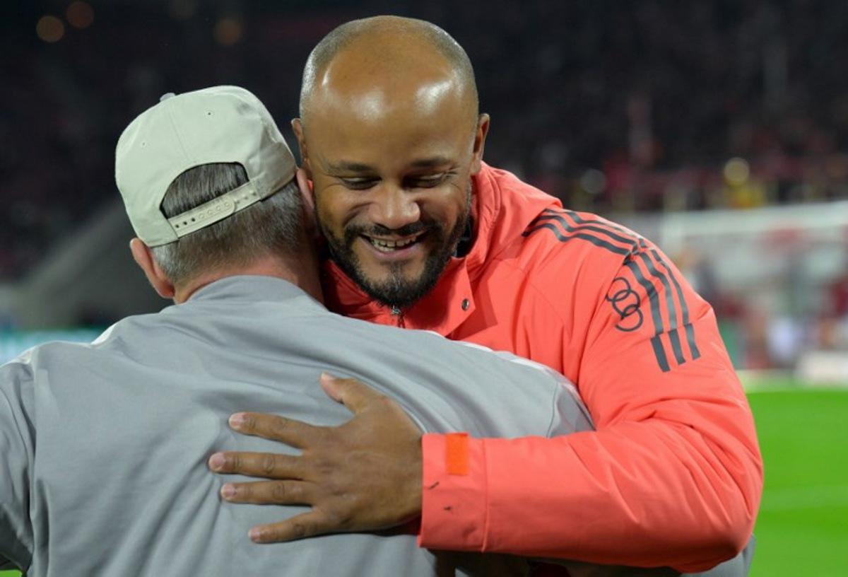 Bayern Munich's Belgian head coach Vincent Kompany embraces FC Cologne's German head coach Lukas Kwasniok prior to the German Cup (DFB Pokal) second round football match between 1 FC Cologne and FC Bayern Munich in Cologne, western Germany on October 29, 2025. Sascha Schuermann / AFP