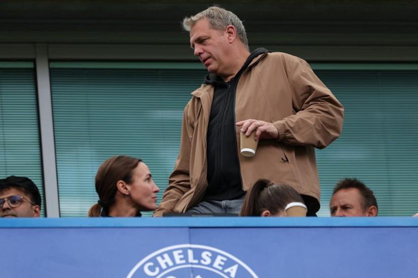 Chelsea's US owner Todd Boehly (C) takes his seat before the start of the English Premier League football match between Chelsea and Brighton and Hove Albion at Stamford Bridge in London on August 30, 2026. Adrian Dennis / AFP