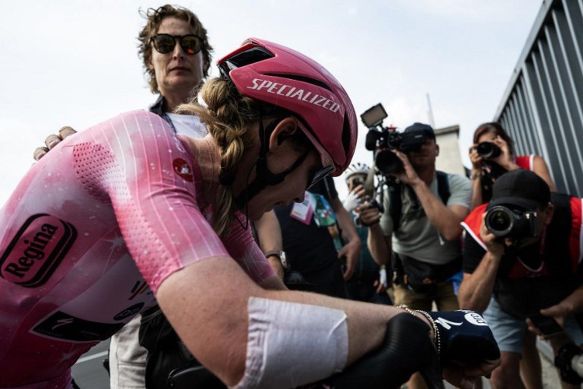 SD Worx Dutch rider Anna Van Der Breggen, wearing the overall leader's pink jersey (Maglia Rosa), reacts after she crossed the finish line after the 9th stage of the Giro Italia Women 2026 - Tour of Italy Women cycling race between Saluzzo and Saluzzo, and place third overall on June 7, 2026. MARCO BERTORELLO / AFP