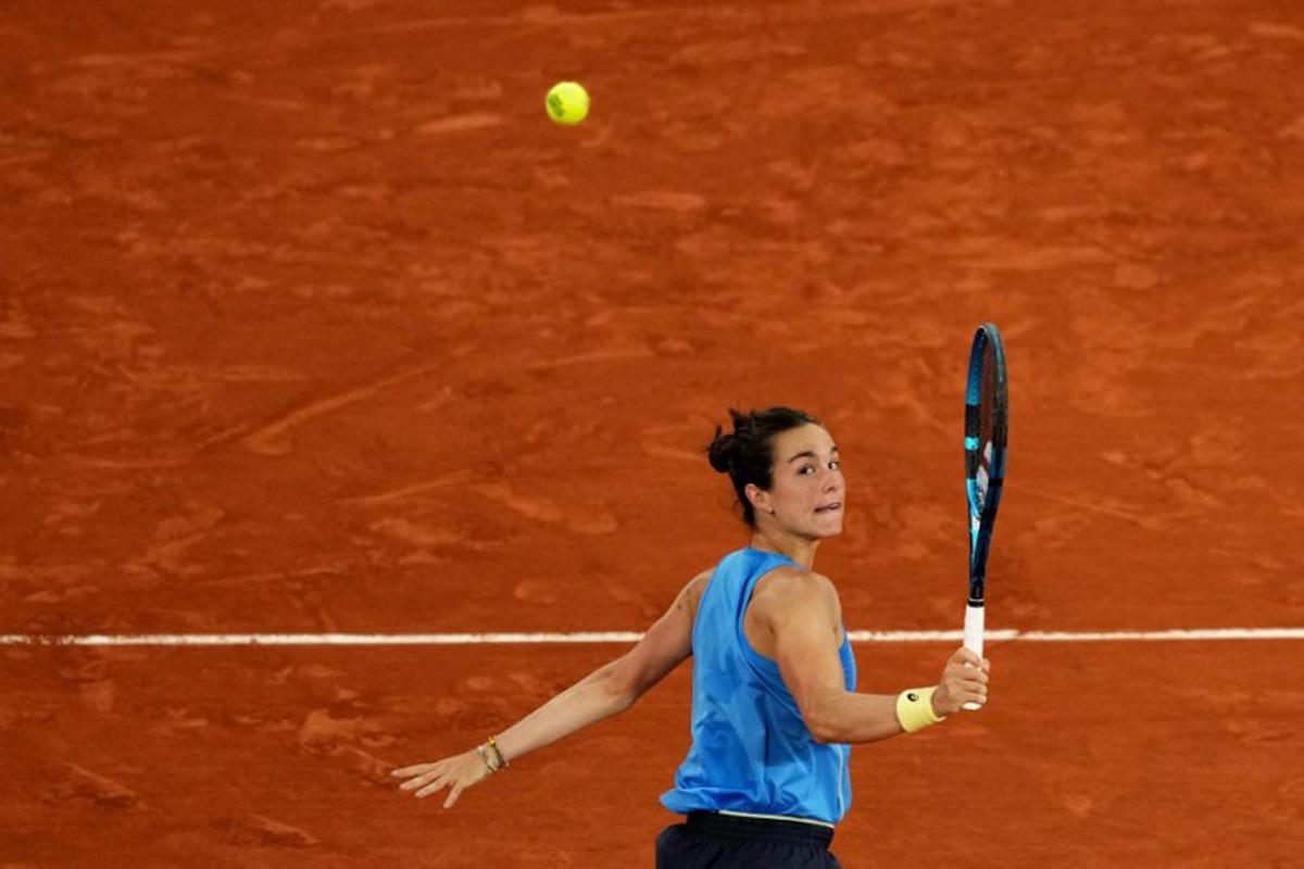 France's Lois Boisson eyes the ball as she plays against Russia's Mirra Andreeva during their women's singles quarter-final match on day 11 of the French Open tennis tournament on Court Philippe-Chatrier at the Roland-Garros Complex in Paris on June 4, 2025. Dimitar DILKOFF / AFP