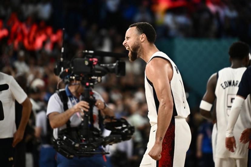 USA's #04 Stephen Curry celebrates after the USA won the men's semifinal basketball match between USA and Serbia during the Paris 2024 Olympic Games at the Bercy Arena in Paris on August 8, 2024. Aris MESSINIS / AFP