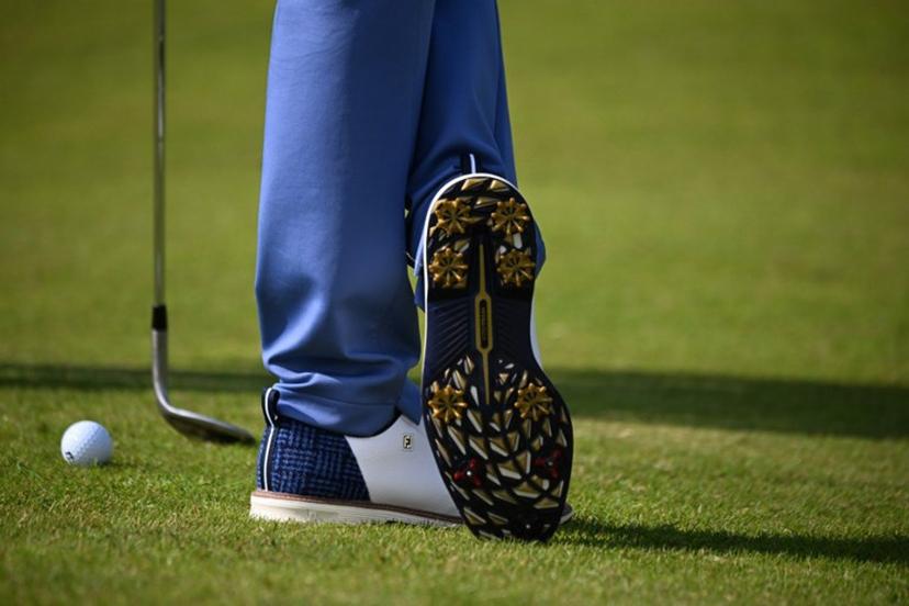 A detailed view of the shoes of US golfer Justin Thomas, seen during practice ahead of the 152nd British Open Golf Championship at Royal Troon on the south west coast of Scotland on July 15, 2024. ANDY BUCHANAN / AFP