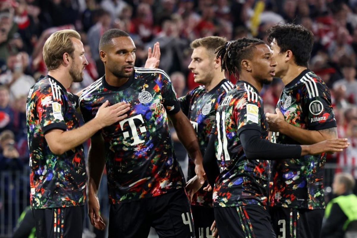 Bayern Munich's English forward #09 Harry Kane (L) celebrates scoring his team's fourth goal with teammates during the German first division Bundesliga football match between FC Bayern Munich and Union Berlin in Munich, southern Germany on September 18, 2026. Alexandra BEIER / AFP