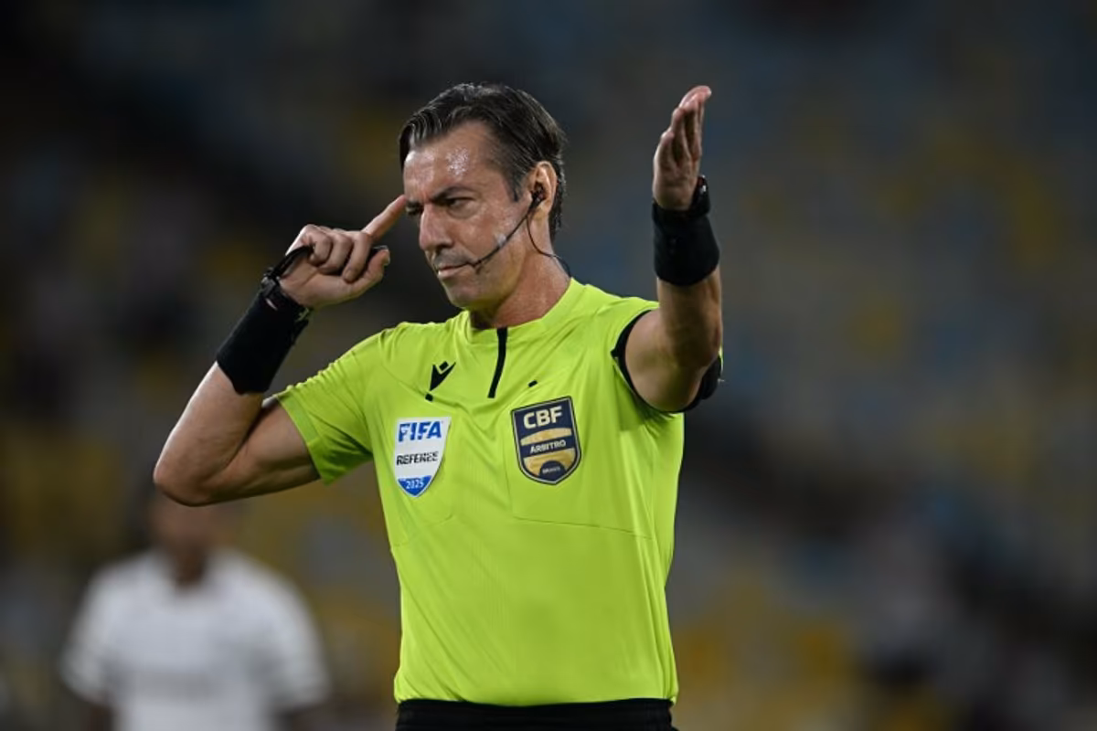 Brazilian referee Raphael Claus gestures during the Brasileirao Serie A football match between Vasco da Gama and Fluminense at the Maracana Stadium in Rio de Janeiro, Brazil, on March 18, 2026. MAURO PIMENTEL / AFP