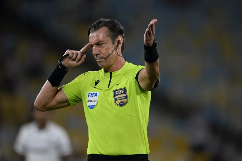 Brazilian referee Raphael Claus gestures during the Brasileirao Serie A football match between Vasco da Gama and Fluminense at the Maracana Stadium in Rio de Janeiro, Brazil, on March 18, 2026. MAURO PIMENTEL / AFP
