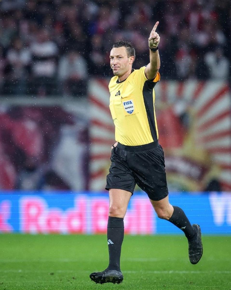 German referee Sven Jablonski gestures during the German first division Bundesliga football match between RB Leipzig and VfB Stuttgart in Leipzig, eastern Germany on November 1, 2025. RONNY HARTMANN / AFP