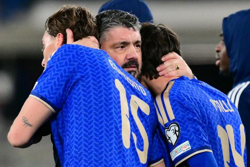 Italy's headcoach Gennaro Gattuso hugs Italy's forward #15 Francesco Pio Esposito and Italy's midfielder #14 Niccolo Pisilli after winning the play-off FIFA World Cup 2026 European qualification semi-final football match between Italy and North Ireland at the Gewiss stadium in Bergamo, on March 26, 2026. Stefano RELLANDINI / AFP