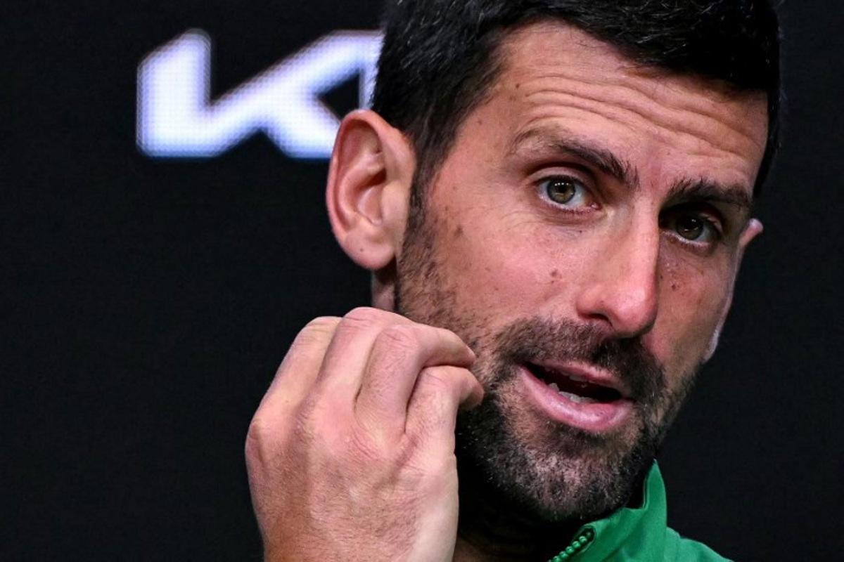 Serbia's Novak Djokovic speaks during a press conference after his defeat against Spain's Carlos Alcaraz in their men's singles final match on day fifteen of the Australian Open tennis tournament in Melbourne on February 1, 2026. WILLIAM WEST / AFP