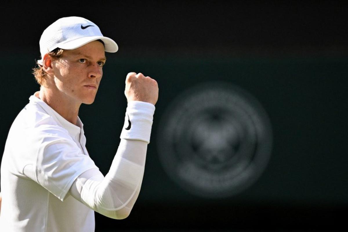 Italy's Jannik Sinner reacts after a point as he plays against Spain's Carlos Alcaraz during their men's singles final tennis match on the fourteenth day of the 2025 Wimbledon Championships at The All England Lawn Tennis and Croquet Club in Wimbledon, southwest London, on July 13, 2025. Kirill KUDRYAVTSEV / AFP