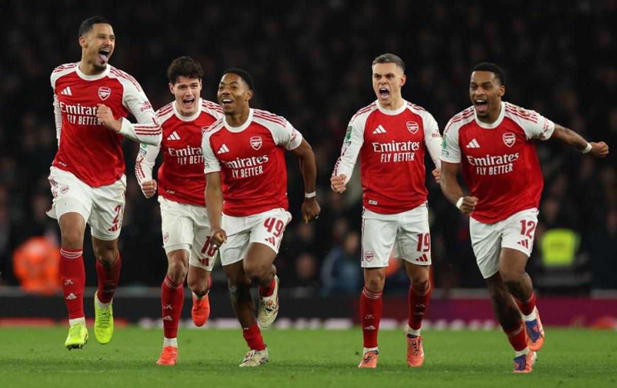 Arsenal's French defender #02 William Saliba (L), Arsenal's Danish defender #16 Christian Norgaard, Arsenal's English midfielder #49 Myles Lewis-Skelly, Arsenal's Belgian midfielder #19 Leandro Trossard and Arsenal's Dutch defender #12 Jurrien Timber celebrate at winning the English League Cup quarter-final football match between Arsenal and Crystal Palace at the Emirates Stadium, in London on December 23, 2025. Adrian Dennis / AFP