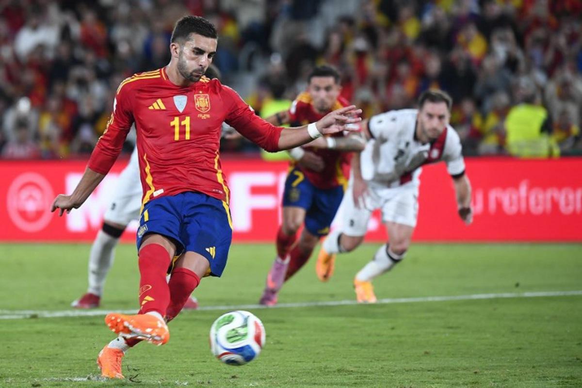 Spain's forward #11 Ferran Torres shoots from the penalty spot during the 2026 World Cup qualifier Europe zone group E football match between Spain and Georgia at Manuel Martinez Valero stadium in Elche on October 11, 2025. Jose Jordan / AFP