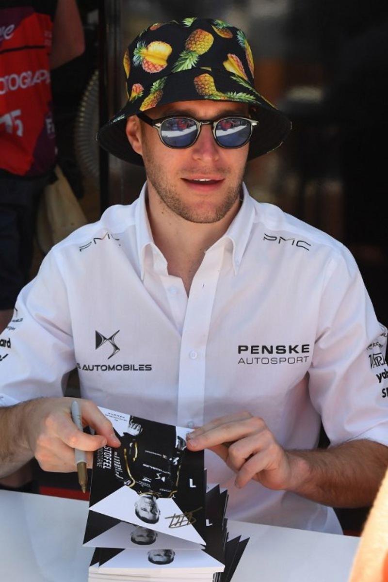 DS Penske's driver Stoffel Vandoorne signs autographs ahead of the 2023 Cape Town E-Prix in Cape town on February 25, 2023. Rodger Bosch / AFP
