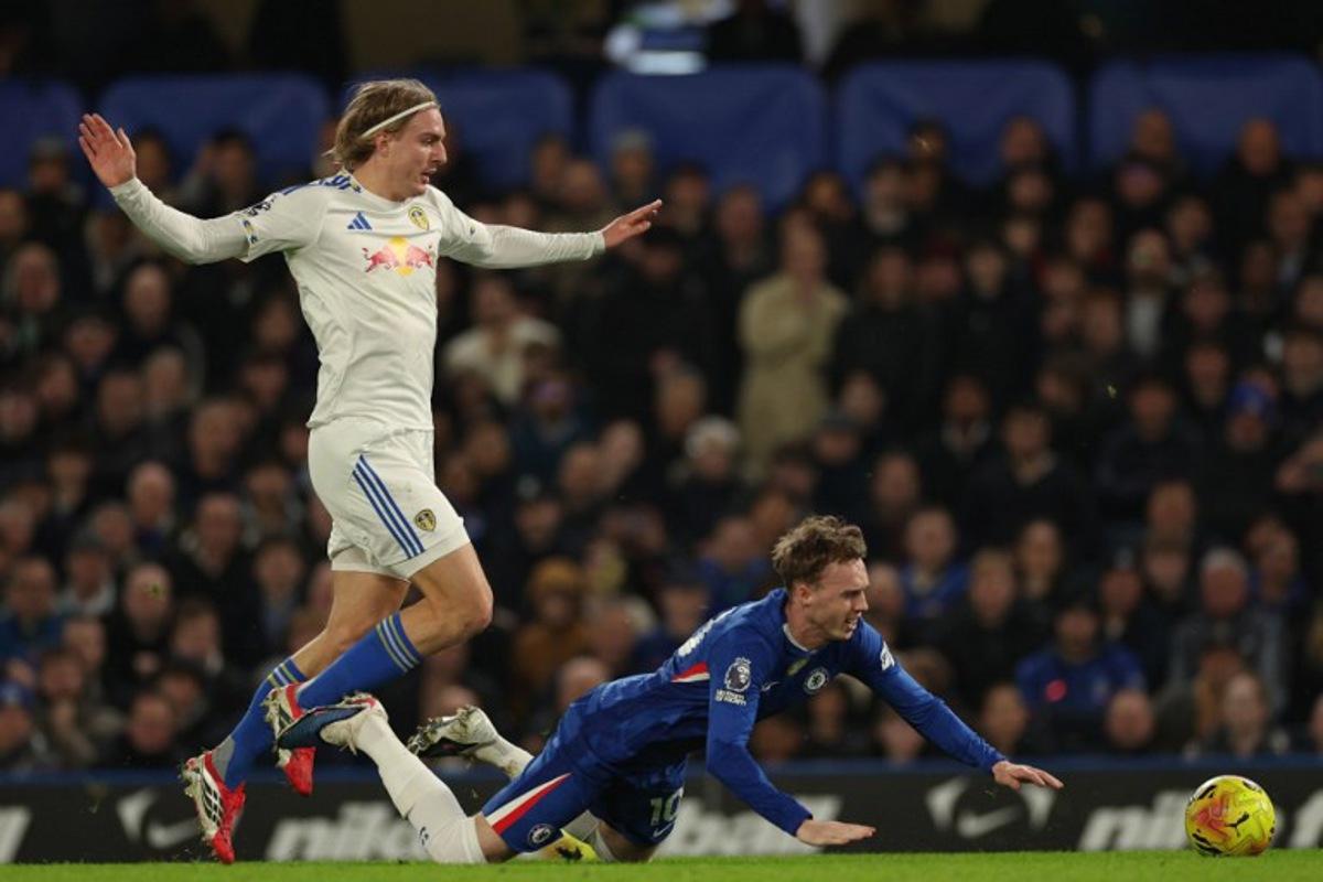 Leeds United's Belgian defender #23 Sebastiaan Bornauw (L) is booked for this foul on Chelsea's English midfielder #10 Cole Palmer (R) during the English Premier League football match between Chelsea and Leeds United at Stamford Bridge in London on February 10, 2026. Adrian Dennis / AFP