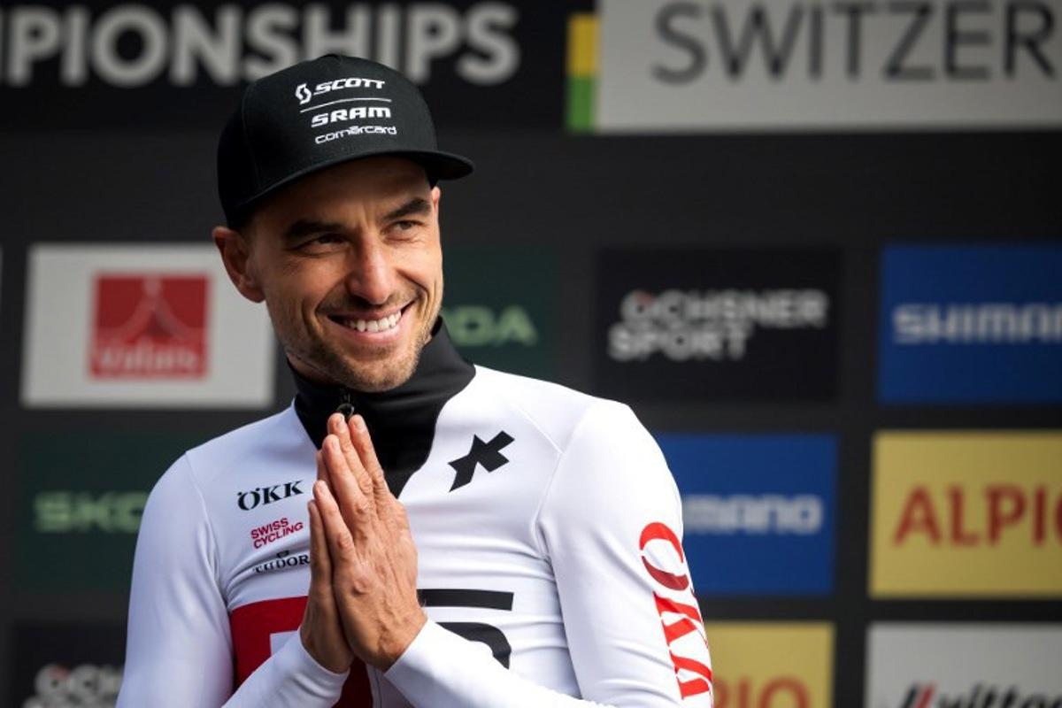 Former Olympic and multiple World champion, Switzerland's Nino Schurter reacts after his last World Championships event on the podium of the Men's elite Cross-country Olympic race as part of the 2025 UCI Mountain Bike World Championships in Crans-Montana on September 14, 2025. Fabrice COFFRINI / AFP