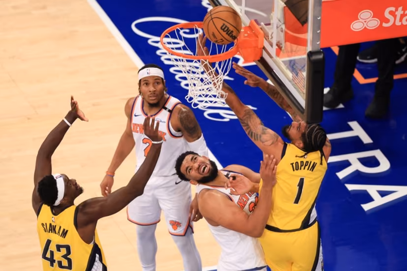 Knicks' center #32 Karl-Anthony Towns and Pacers' power forward #01 Obi Toppin fight for the ball during Game Five of the Eastern Conference Finals of the 2025 NBA Playoffs between the New York Knicks and the Indiana Pacers at Madison Square Garden in New York on May 29, 2025.  CHARLY TRIBALLEAU / AFP