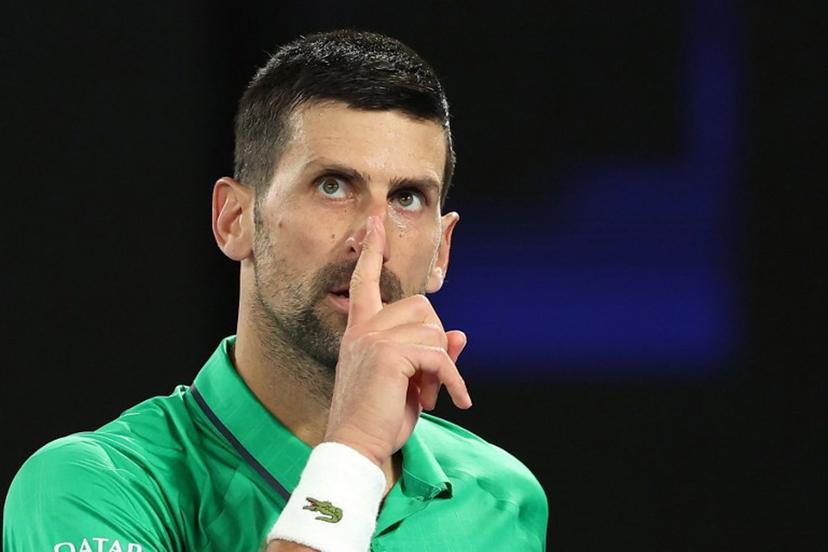 Serbia's Novak Djokovic reacts on a point to Netherlands' Botic van de Zandschulp during their men's singles match on day seven of the Australian Open tennis tournament in Melbourne on January 24, 2026. Martin KEEP / AFP