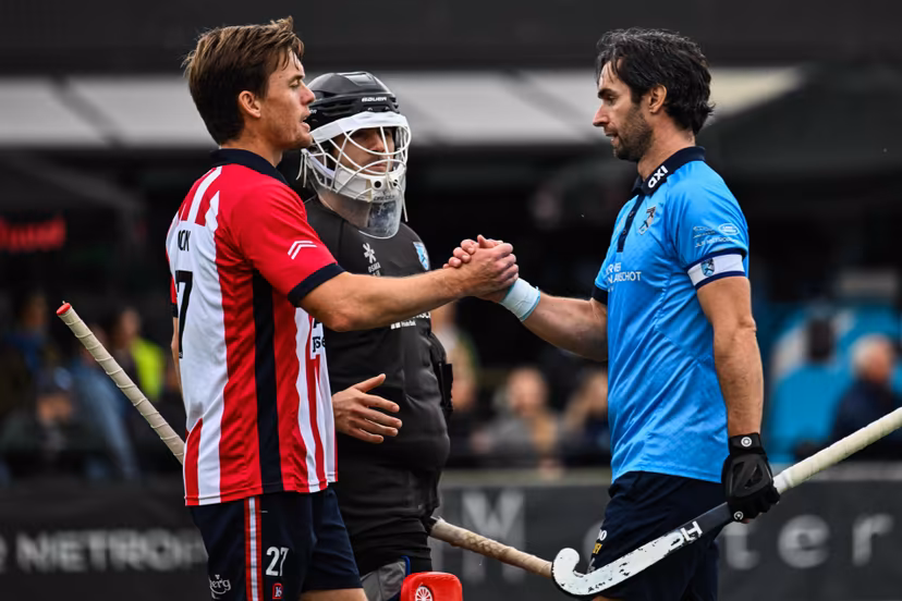 Leopold's Tom Boon and Braxgata's Loick Luypaert pictured after a hockey game between Braxgata and Leopold, Sunday 18 October 2026 in Boom, on day 6 of the Belgian first division hockey championship. BELGA PHOTO EMILE WINDAL