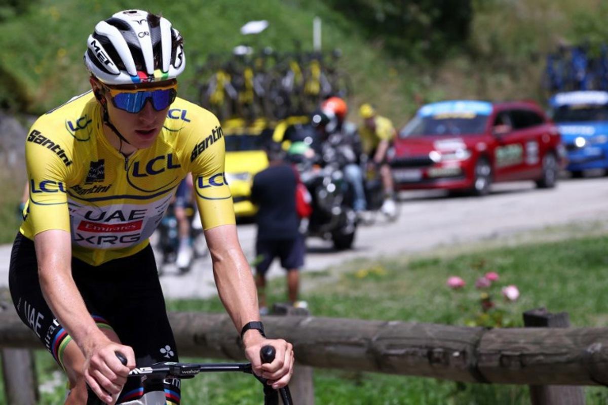 UAE Team Emirates XRG's Slovenian rider Tadej Pogačar wearing the overall leader's yellow jersey cycles during the 7th stage of the 77th edition of the Criterium du Dauphine cycling race, 131,6 km between Grand-Aigueblanche and Valmeinier, on June 14, 2025. Anne-Christine POUJOULAT / AFP