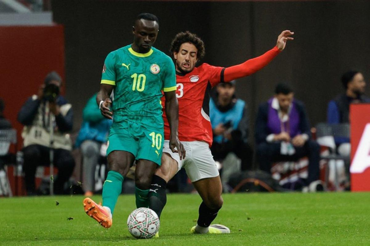 Senegal's forward #10 Sadio Mane and Egypt's defender #3 Mohamed Hany vie during the Africa Cup of Nations (CAN) semi-final football match between Senegal and Egypt at the Grand stadium in Tangiers on January 14, 2026. Abdel Majid BZIOUAT / AFP