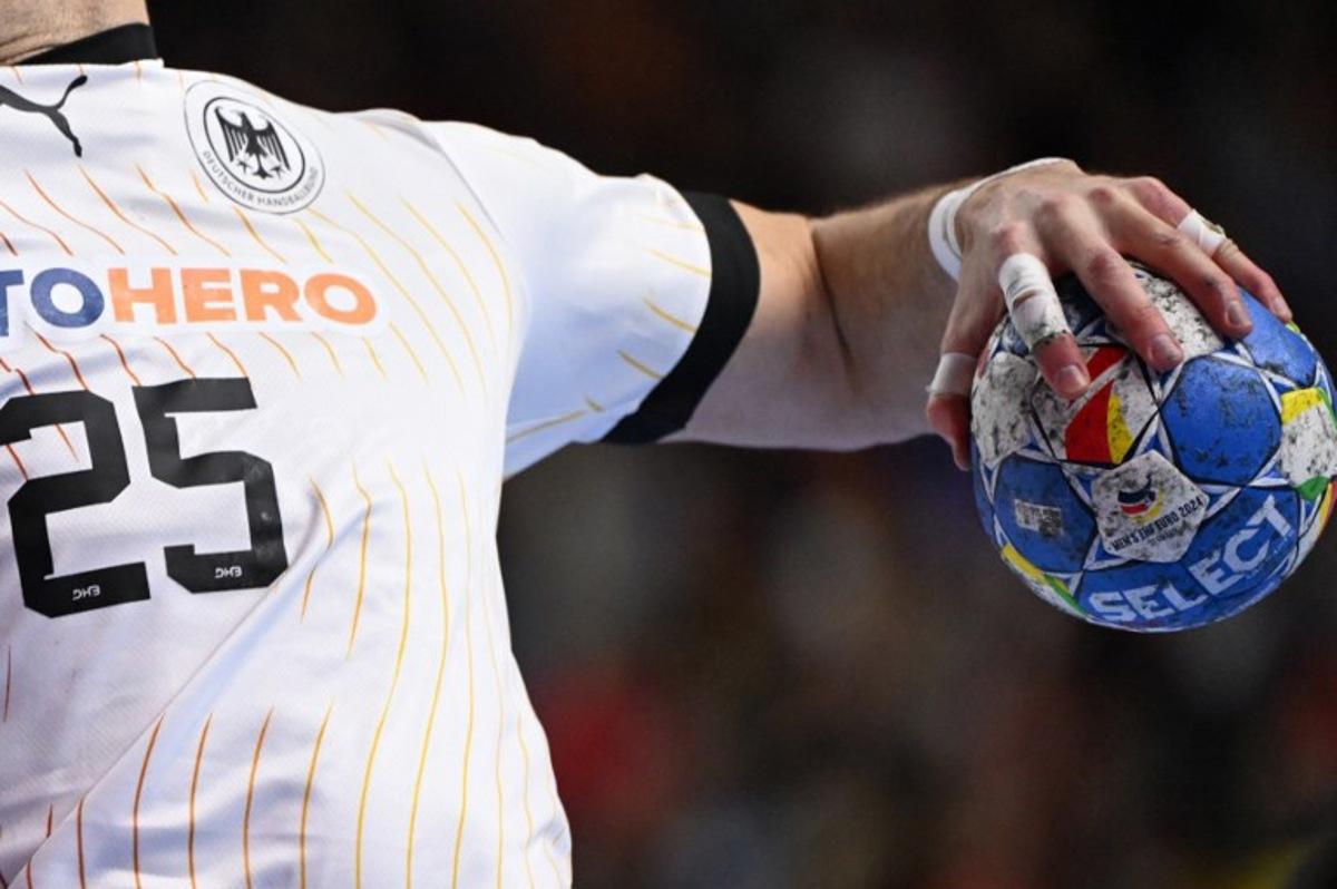 Germany's right back #25 Kai Haefner vies during the Men's EURO 2024 EHF Handball European Championship match for third place between Sweden and Germany in Cologne, western Germany on January 28, 2024. Kirill KUDRYAVTSEV / AFP