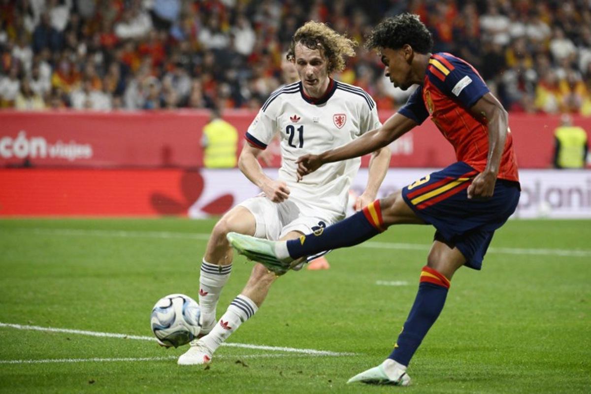 Spain's forward #19 Lamine Yamal is challenged by Czech Republic's midfielder #21 Alex Kral during the UEFA Nations League Group A3 football match between Spain and the Czech Republic at the Carlos Tartiere Stadium in Oviedo on October 3, 2026 Miguel RIOPA / AFP