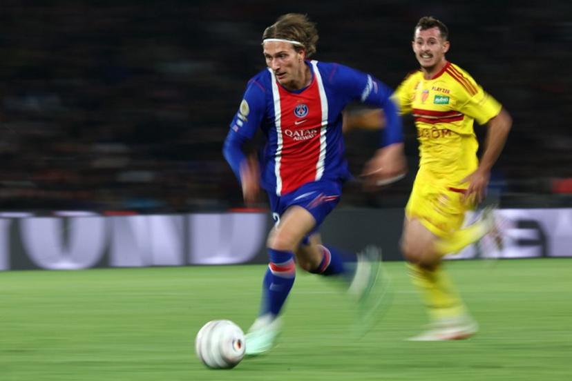 PSG's Belgian forward #22 Mika Godts runs with the ball during the French L1 football match between Paris Saint-Germain (PSG) and Le Mans FC at the Parc des Princes stadium in Paris on October 10, 2026. FRANCK FIFE / AFP