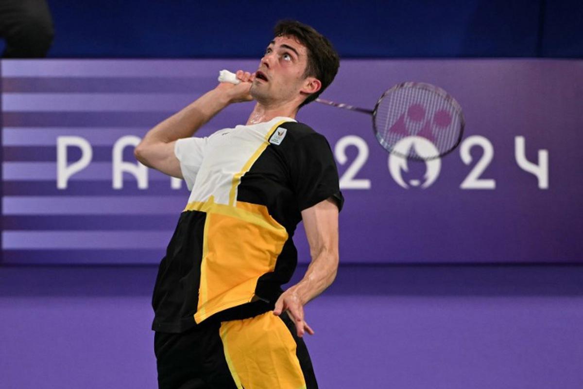 Belgium's Julien Carraggi plays a shot against India's Lakshya Sen in their men's singles badminton group stage match during the Paris 2024 Olympic Games at Porte de la Chapelle Arena in Paris on July 29, 2024. Arun SANKAR / AFP