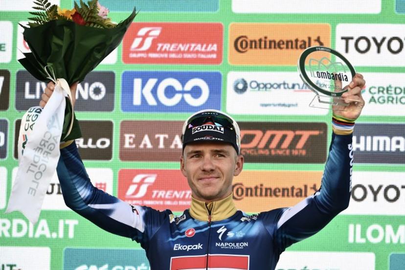Second-placed Soudal Quick-Step's Belgian rider Remco Evenepoel celebrates on the podium after the 119th edition of the Giro di Lombardia (Tour of Lombardy), a 238km cycling race from Como to Bergamo on October 11, 2025. Marco BERTORELLO / AFP