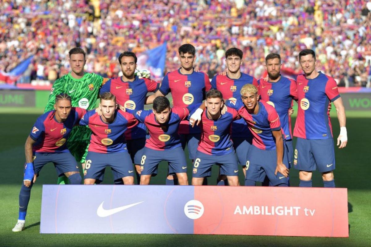 Barcelona players pose for team photo before the Spanish league football match between FC Barcelona and Villarreal CF at Estadi Olimpic Lluis Companys in Barcelona on May 18, 2025. MANAURE QUINTERO / AFP