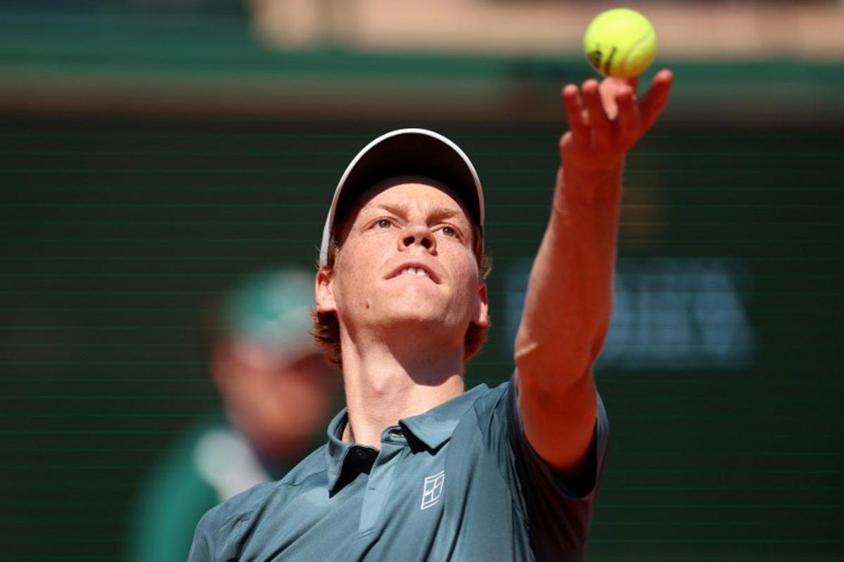 Italy's Jannik Sinner eyes the ball as he serves to Czech Republic's Tomas Machac during their Monte Carlo ATP Masters Series Tournament round of 16 tennis match on Court Rainier III at the Monte-Carlo Country Club in Roquebrune-Cap-Martin, south-eastern France on April 9, 2026. Valery HACHE / AFP
