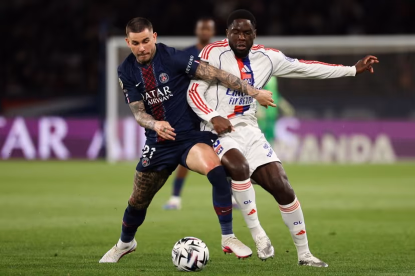 Paris Saint-Germain's French defender #21 Lucas Hernandez (L) fights for the ball with Lyon's Belgian midfielder #05 Orel Mangala during the French L1 football match between Paris Saint-Germain (PSG) and Olympique Lyonnais (OL) at the Parc des Princes stadium in Paris on April 19, 2026. FRANCK FIFE / AFP