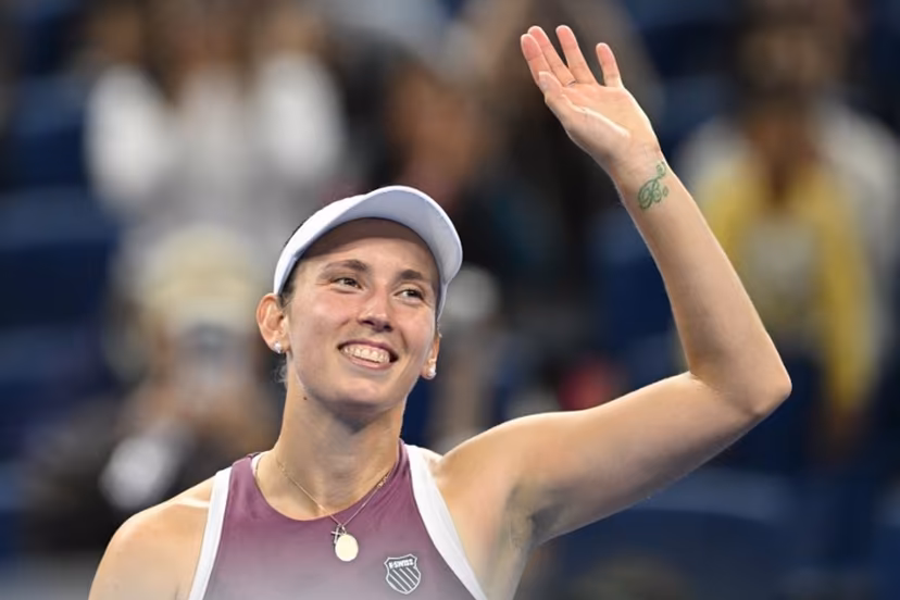 Belgium's Elise Mertens celebrates after beating Poland's Iga Swiatek in their women's singles quarter-final at the China Open tennis tournament in Beijing on October 9, 2026. GREG BAKER / AFP