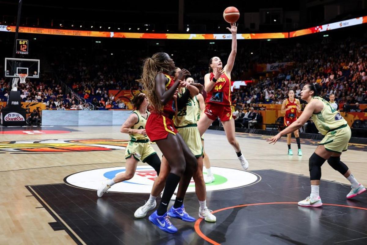 Australia's center #22 Zitina Aokuso (R) and Spain's point guard #44 Iyana Martin (C) vie for the ball during the 2026 FIBA Women's Basketball World Cup quarter-final match between Australia and Spain at the Berlin Arena in Berlin on September 10, 2026. Ronny HARTMANN / AFP