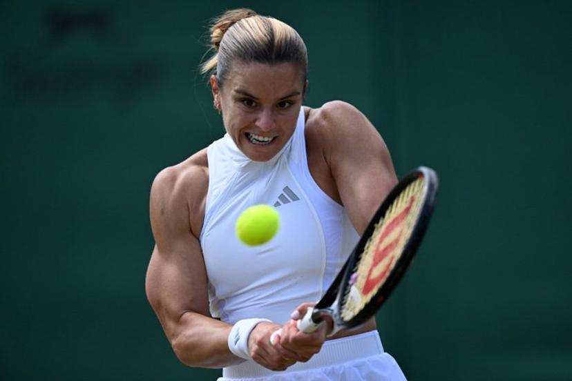 Greece's Maria Sakkari returns against Italy's Jasmine Paolini during their women's singles third round tennis match on the sixth day of the 2026 Wimbledon Championships at The All England Lawn Tennis and Croquet Club in Wimbledon, southwest London, on July 4, 2026. Kirill KUDRYAVTSEV / AFP