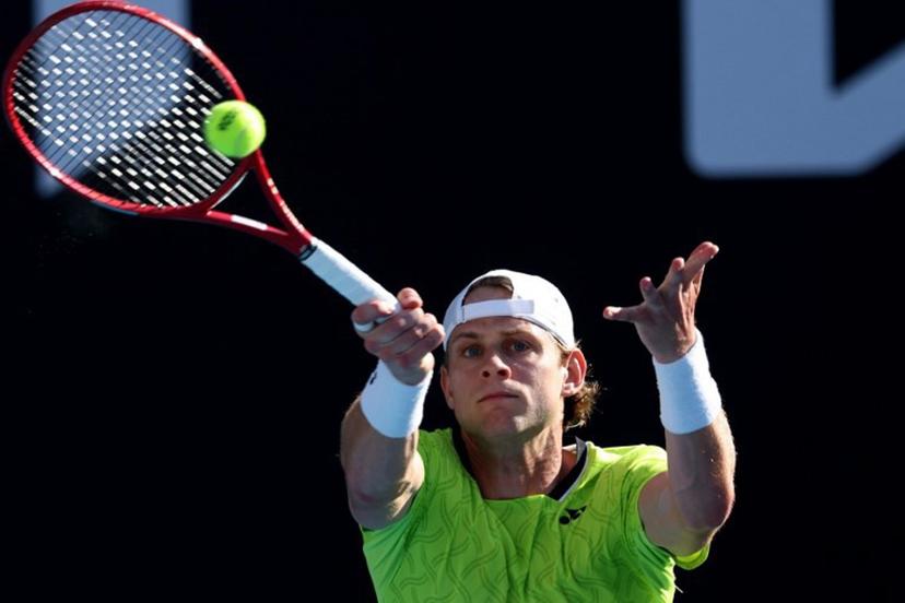 Belgium's Zizou Bergs hits a return to Poland's Hubert Hurkacz during their men's singles match on day three of the Australian Open tennis tournament in Melbourne on January 20, 2026. IZHAR KHAN / AFP