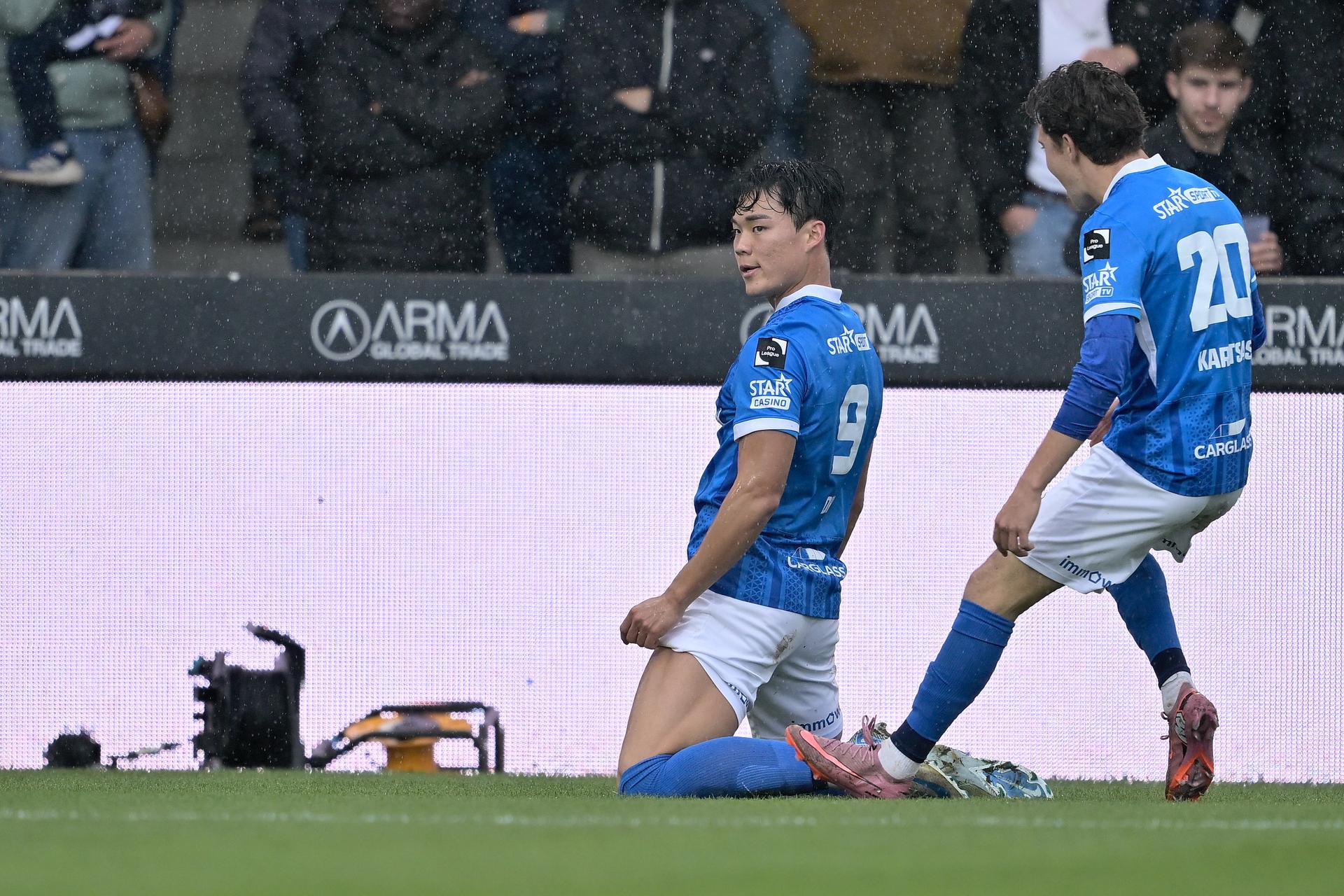 Genk's Hyeon-Gyu Oh and Genk's Konstantinos Kos Karetsas celebrate after scoring during a soccer match between KVC Westerlo and KRC Genk, Sunday 02 November 2025 in Westerlo, on day 13 of the 2025-2026 'Jupiler Pro League' first division of the Belgian championship. BELGA PHOTO JOHAN EYCKENS