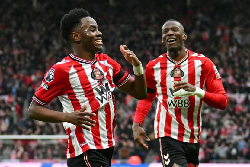 Sunderland's English Ivorian #24 Simon Adingra (L) celebrates after scoring the opening goal of the English Premier League football match between Sunderland and Leeds United at The Stadium of Light in Sunderland in north east England on December 28, 2025. ANDY BUCHANAN / AFP