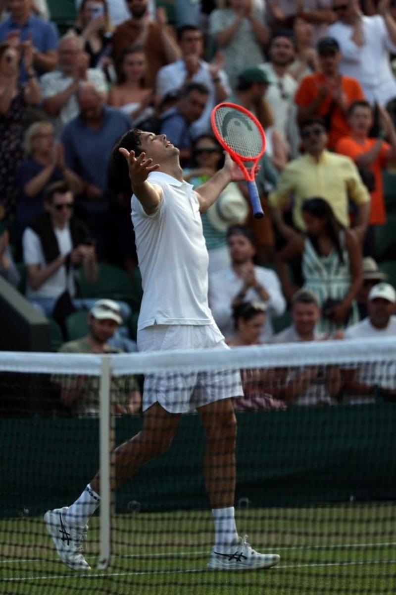 US player Taylor Fritz celebrates beating Italy's Lorenzo Sonego during their men's singles third round tennis match on the sixth day of the 2026 Wimbledon Championships at The All England Lawn Tennis and Croquet Club in Wimbledon, southwest London, on July 4, 2026. Adrian Dennis / AFP