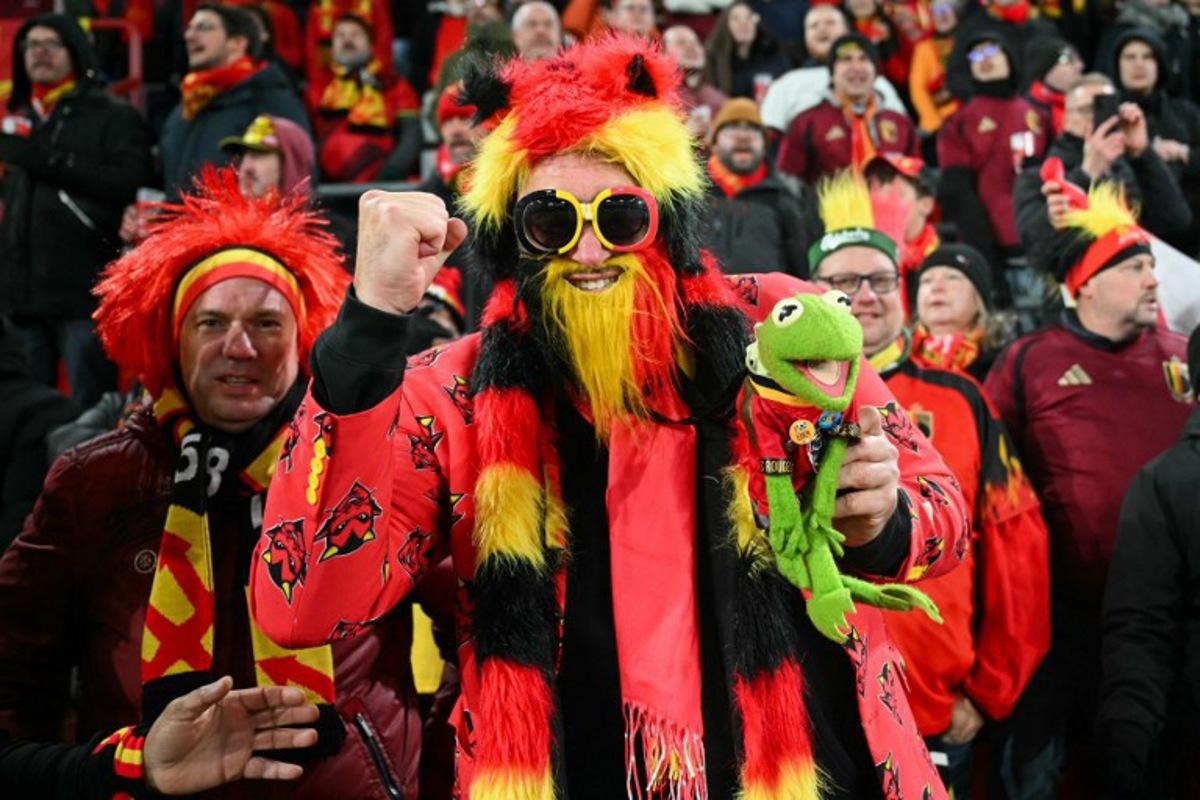 Belgian supporters cheer ahead of the FIFA World Cup 2026 Group J European qualification football match between Belgium and Liechtenstein at the Maurice-Dufrasne stadium, in Liege, on November 18, 2025. NICOLAS TUCAT / AFP