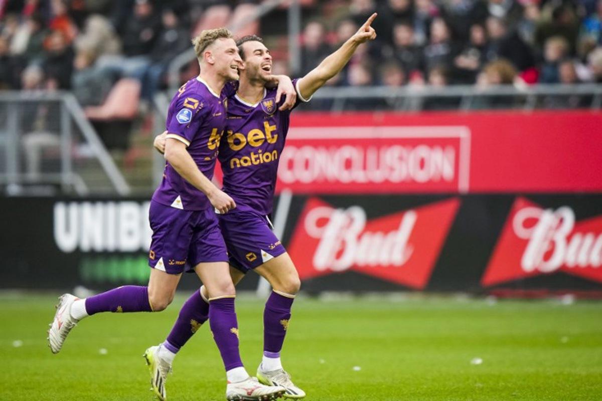 Go Ahead Eagles' Joris Kramer (L) and Enric Llansana celebrate the 0-1 during the Dutch Eredivisie football match between PSV Eindhoven and Go Ahead Eagles at Galgenwaard stadium in Utrecht on December 15, 2024. Tobias Kleuver / ANP / AFP