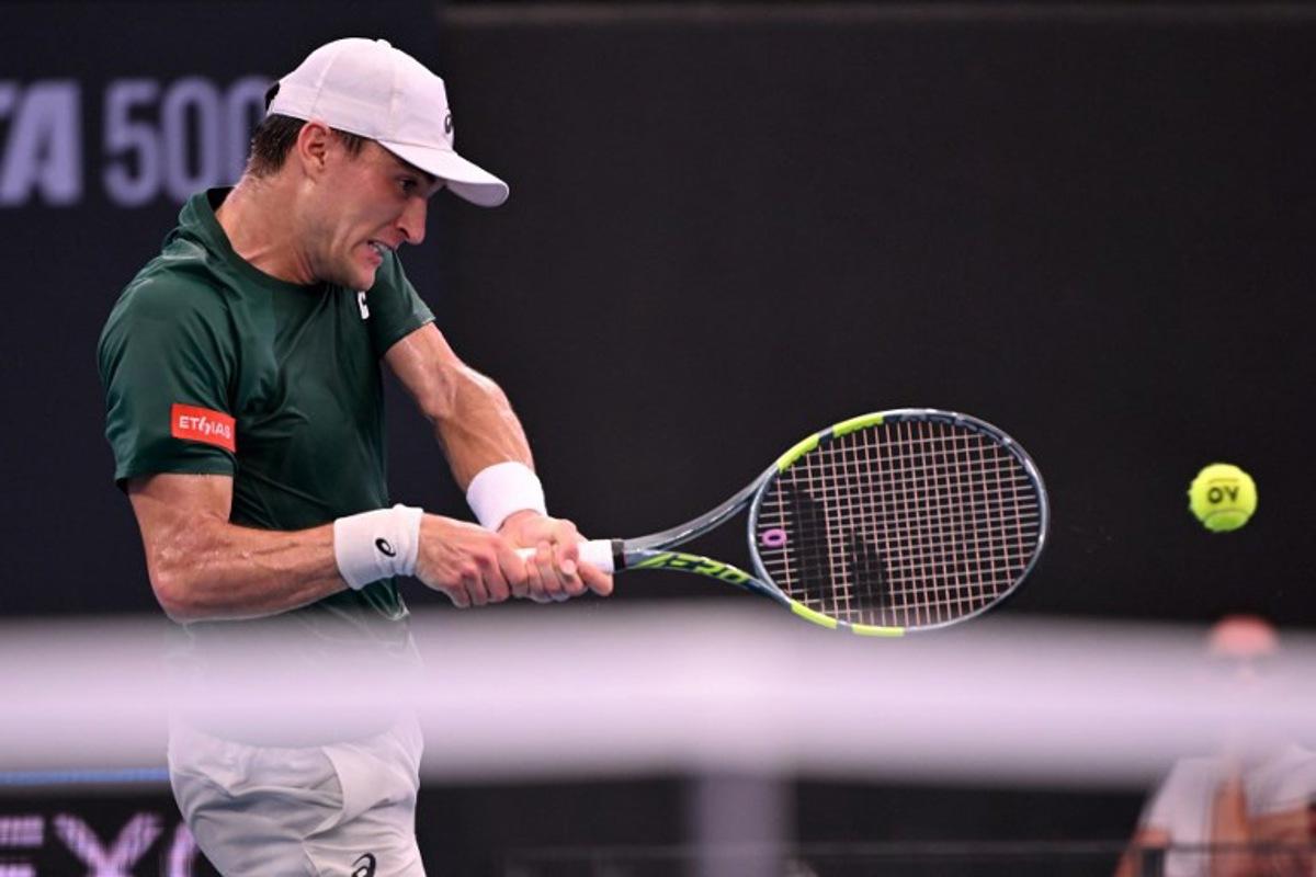 Raphael Collignon of Belgium hits a return during his men's singles match against Brandon Nakashima of the US at the Brisbane International tennis tournament in Brisbane on January 9, 2026. William WEST / AFP